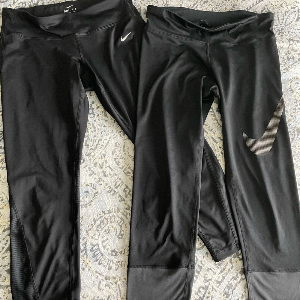 2 pairs of women’s Nike dri-fit running capris